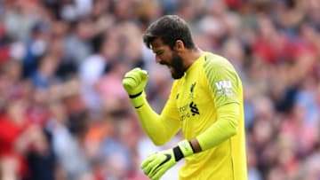 LIVERPOOL, ENGLAND - AUGUST 12: Alisson of Liverpool celebrates his team's first goal during the Premier League match between Liverpool FC and West Ham United at Anfield on August 12, 2018 in Liverpool, United Kingdom. (Photo by Laurence Griffiths/Getty Images)