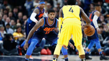 INDIANAPOLIS, IN - DECEMBER 13: Paul George #13 of the Oklahoma City Thunder defends Victor Oladipo #4 of Indiana Pacers during the game at Bankers Life Fieldhouse on December 13, 2017 in Indianapolis, Indiana. NOTE TO USER: User expressly acknowledges and agrees that, by downloading and or using this photograph, User is consenting to the terms and conditions of the Getty Images License Agreement. (Photo by Andy Lyons/Getty Images)
