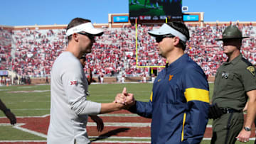 Oct 19, 2019; Norman, OK, USA; Oklahoma Sooners head coach Lincoln Riley (left) greets West Virginia Mountaineers head coach Neal Brown after the game at Gaylord Family - Oklahoma Memorial Stadium. Mandatory Credit: Kevin Jairaj-USA TODAY Sports