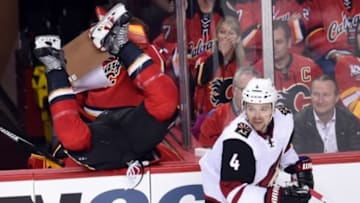 Mar 11, 2016; Calgary, Alberta, CAN; Calgary Flames center Lance Bouma (17) goes over the boards after a check on Arizona Coyotes defenseman Zbynek Michalek (4) during the second period at Scotiabank Saddledome. Mandatory Credit: Candice Ward-USA TODAY Sports