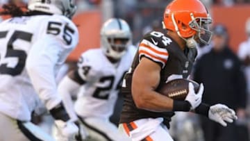 Oct 26, 2014; Cleveland, OH, USA; Cleveland Browns tight end Jordan Cameron (84) makes a reception between Oakland Raiders free safety Charles Woodson (24) and outside linebacker Sio Moore (55) during the second quarter at FirstEnergy Stadium. Mandatory Credit: Ron Schwane-USA TODAY Sports