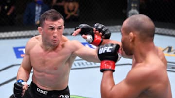 LAS VEGAS, NEVADA - AUGUST 15: (L-R) Merab Dvalishvili of Georgia punches John Dodson in their bantamweight bout during the UFC 252 event at UFC APEX on August 15, 2020 in Las Vegas, Nevada. (Photo by Jeff Bottari/Zuffa LLC)