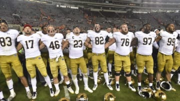 BLACKSBURG, VA - OCTOBER 6: Members of the Notre Dame Fighting Irish sing the fight song following the victory against the Virginia Tech Hokies at Lane Stadium on October 6, 2018 in Blacksburg, Virginia. (Photo by Michael Shroyer/Getty Images)
