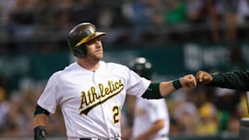 Jul 15, 2016; Oakland, CA, USA; Oakland Athletics catcher Stephen Vogt (21) celebrates scoring against the Toronto Blue Jays in the fourth inning at O.co Coliseum. Mandatory Credit: John Hefti-USA TODAY Sports