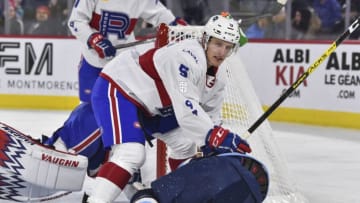 LAVAL, QC - NOVEMBER 15: David Sklenicka #5 of the Laval Rocket holds down Laurent Dauphin #91 of the Milwaukee Admirals during the third period at Place Bell on November 15, 2019 in Laval, Canada. The Milwaukee Admirals defeated the Laval Rocket 5-2. (Photo by Minas Panagiotakis/Getty Images)