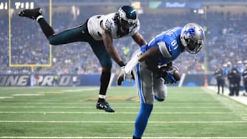 Nov 26, 2015; Detroit, MI, USA; Detroit Lions wide receiver Calvin Johnson (81) scores a touchdown while being pressured by Philadelphia Eagles cornerback Eric Rowe (32) during the third quarter of a NFL game on Thanksgiving at Ford Field. Mandatory Credit: Tim Fuller-USA TODAY Sports