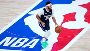 Former Duke basketball standout Seth Curry dribbles across half court. (Photo by Ashley Landis-Pool/Getty Images)
