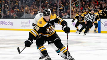 BOSTON, MA - OCTOBER 29: Boston Bruins center Charlie Coyle (13) corrals the puck during a game between the Boston Bruins and the San Jose Sharks on October 29, 2019, at TD Garden in Boston, Massachusetts. (Photo by Fred Kfoury III/Icon Sportswire via Getty Images)