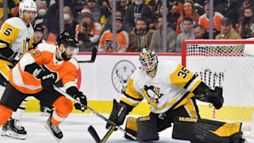 Jan 6, 2022; Philadelphia, Pennsylvania, USA; Pittsburgh Penguins goaltender Tristan Jarry (35) makes a save against Philadelphia Flyers center Derick Brassard (19) during the second period at Wells Fargo Center. Mandatory Credit: Eric Hartline-USA TODAY Sports