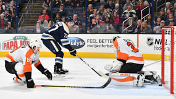 COLUMBUS, OH - OCTOBER 18: Josh Anderson #77 of the Columbus Blue Jackets beats Calvin Pickard #33 of the Philadelphia Flyers for a goal as Robert Hagg #8 skates back on defense during the third period on October 18, 2018 at Nationwide Arena in Columbus, Ohio. (Photo by Jamie Sabau/NHLI via Getty Images)