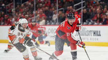 WASHINGTON, DC - NOVEMBER 18: Garnet Hathaway #21 of the Washington Capitals skates with the puck against Sam Steel #34 of the Anaheim Ducks in the first period at Capital One Arena on November 18, 2019 in Washington, DC. (Photo by Patrick McDermott/NHLI via Getty Images)