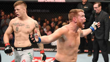 MELBOURNE, AUSTRALIA - FEBRUARY 10: (R-L) Sam Alvey reacts after his TKO loss to Jim Crute of Australia in their light heavyweight bout during the UFC 234 at Rod Laver Arena on February 10, 2019 in the Melbourne, Australia. (Photo by Jeff Bottari/Zuffa LLC/Zuffa LLC via Getty Images)