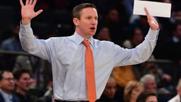 NEW YORK, NEW YORK - DECEMBER 04: Head coach Mike White of the Florida Gators directs his players during the first half of the game against the West Virginia Mountaineers at Madison Square Garden on December 04, 2018 in New York City. (Photo by Sarah Stier/Getty Images)