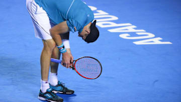 ACAPULCO, MEXICO - FEBRUARY 26: John Isner of United States reacts during the match between John Isner of United States and Ryan Harrison of United States as part of the Telcel Mexican Open 2018 at Mextenis Stadium on February 26, 2018 in Acapulco, Mexico. (Photo by Hector Vivas/Getty Images)