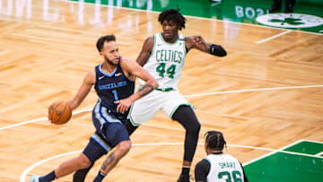 BOSTON, MA - DECEMBER 30: Kyle Anderson #1 of the Memphis Grizzlies dribbles the ball past Robert Williams III #44 of the Boston Celtics in the second half at TD Garden on December 30, 2020 in Boston, Massachusetts. (Photo by Kathryn Riley/Getty Images)