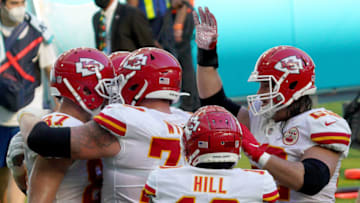 MIAMI GARDENS, FLORIDA - DECEMBER 13: Austin Reiter (R) #62 of the Kansas City Chiefs and his teammates celebrate a touchdown by Travis Kelce #87 against the Miami Dolphins during second quarter in the game at Hard Rock Stadium on December 13, 2020 in Miami Gardens, Florida. (Photo by Mark Brown/Getty Images)