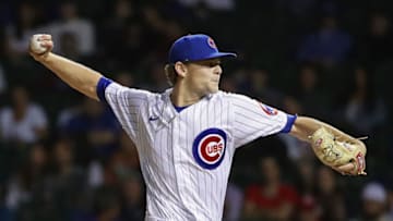 CHICAGO, ILLINOIS - SEPTEMBER 08: Codi Heuer #12 of the Chicago Cubs pitches against the Cincinnati Reds at Wrigley Field on September 08, 2021 in Chicago, Illinois. The Cubs defeated the Reds 4-1 in 10 innings. (Photo by Jonathan Daniel/Getty Images)