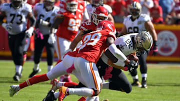 Oct 23, 2016; Kansas City, MO, USA; New Orleans Saints tight end Coby Fleener (82) runs the ball and is tackled by Kansas City Chiefs strong safety Eric Berry (29) and defensive back Daniel Sorensen (49) during the first half at Arrowhead Stadium. Mandatory Credit: Denny Medley-USA TODAY Sports