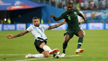 SAINT PETERSBURG, RUSSIA - JUNE 26: Nicolas Otamendi of Argentina slides in to tackle Odion Ighalo of Nigeria during the 2018 FIFA World Cup Russia group D match between Nigeria and Argentina at Saint Petersburg Stadium on June 26, 2018 in Saint Petersburg, Russia. (Photo by Gabriel Rossi/Getty Images)