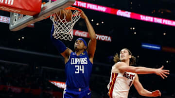 LOS ANGELES, CA - DECEMBER 08: Los Angeles Clippers forward Tobias Harris (34) dunks the ball past Miami Heat forward Kelly Olynyk (9) during the game on December 08, 2018, at Staples Center in Los Angeles, CA. (Photo by Adam Davis/Icon Sportswire via Getty Images)