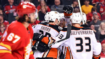 CALGARY, AB - MARCH 29: Anaheim Ducks Defenceman Andy Welinski (45) celebrates his first NHL goal with Anaheim Ducks Right Wing Jakob Silfverberg (33) and Center Devin Shore (29) and teammates during the first period of an NHL game where the Calgary Flames hosted the Anaheim Ducks on March 29, 2019, at the Scotiabank Saddledome in Calgary, AB. (Photo by Brett Holmes/Icon Sportswire via Getty Images)