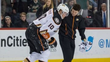 Dec 5, 2014; Saint Paul, MN, USA; Anaheim Ducks forward Corey Perry (10) is helped off the ice following an injury during the first period against the Minnesota Wild at Xcel Energy Center. Mandatory Credit: Brace Hemmelgarn-USA TODAY Sports