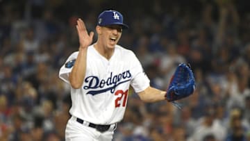 LOS ANGELES, CA - OCTOBER 26: Walker Buehler #21 of the Los Angeles Dodgers reacts after retiring the side during the fourth inning against the Boston Red Sox in Game Three of the 2018 World Series at Dodger Stadium on October 26, 2018 in Los Angeles, California. (Photo by Harry How/Getty Images)