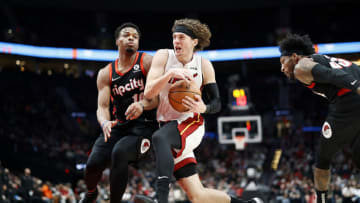 Kyle Guy # 5 of the Miami Heat drives to the basket against Dennis Smith Jr. # 10 of the Portland Trail Blazers(Photo by Soobum Im/Getty Images)