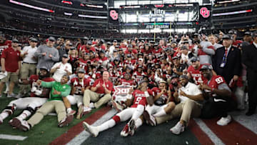 ARLINGTON, TX - DECEMBER 02: The Oklahoma Sooners pose for a team photo after winning the Big 12 Championship against the TCU Horned Frogs 41-17 at AT