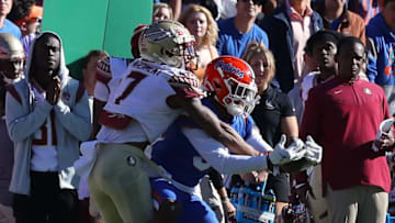 Florida Gators cornerback Jason Marshall Jr. (3) makes an interception near the sideline during a game against Florida State University at Ben Hill Griffin Stadium in Gainesville Fla., Nov. 27, 2021.Flagi 112721 Ufvfsu Fb 28