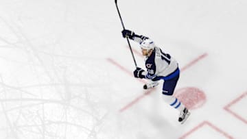 Feb 16, 2016; Raleigh, NC, USA; Winnipeg Jets forward Bryan Little (18) gets ready for a shot against the Carolina Hurricanes at PNC Arena. The Carolina Hurricanes defeated the Winnipeg Jets 2-1. Mandatory Credit: James Guillory-USA TODAY Sports