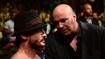 Jul 11, 2015; Las Vegas, NV, USA; Brad Pickett (red gloves) is talked to by UFC president Dana White after being knocked out by Thomas Almeida (not pictured) during UFC 189 at MGM Grand Garden Arena. Almeida won via second round knockout. Mandatory Credit: Joe Camporeale-USA TODAY Sports