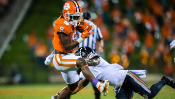 Oct 3, 2020; Clemson, South Carolina, USA; Clemson running back Travis Etienne (9) runs the ball during their game against Virginia at Memorial Stadium. Mandatory Credit: Ken Ruinard-USA TODAY Sports