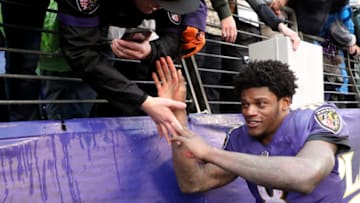 BALTIMORE, MARYLAND - DECEMBER 16: Lamar Jackson #8 of the Baltimore Ravens celebrates with fans following the Ravens 20-12 win over the Tampa Bay Buccaneers at M&T Bank Stadium on December 16, 2018 in Baltimore, Maryland. (Photo by Rob Carr/Getty Images)