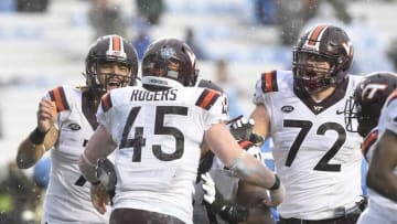 Oct 8, 2016; Chapel Hill, NC, USA; Virginia Tech Hokies fullback Sam Rogers (45) celebrates with tight end Bucky Hodges (7) and offensive lineman Jonathan McLaughlin (71) and Augie Conte (72) after scoring a touchdown in the third quarter. The Hokies defeated the Tar Heels 34-3 at Kenan Memorial Stadium. Mandatory Credit: Bob Donnan-USA TODAY Sports