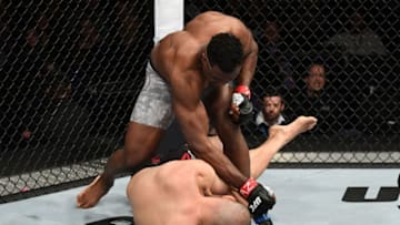 PHOENIX, ARIZONA - FEBRUARY 17: Francis Ngannou of Cameroon (top) punches Cain Velasquez in their heavyweight bout during the UFC Fight Night event at Talking Stick Resort Arena on February 17, 2019 in Phoenix, Arizona. (Photo by Josh Hedges/Zuffa LLC/Zuffa LLC via Getty Images)