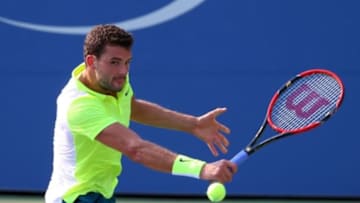Sep 2, 2015; New York, NY, USA; Grigor Dimitrov of Bulgaria returns a shot to Mikhail Kukushkin of Kazakhstan on day three of the 2015 U.S. Open tennis tournament at USTA Billie Jean King National Tennis Center. Mandatory Credit: Jerry Lai-USA TODAY Sports