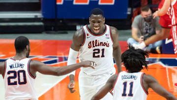 Feb 6, 2021; Champaign, Illinois, USA; Illinois Fighting Illini center Kofi Cockburn (21) celebrates with guard Da'Monte Williams (20) and guard Ayo Dosunmu (11) during the second half against the Wisconsin Badgers at State Farm Center. Mandatory Credit: Patrick Gorski-USA TODAY Sports