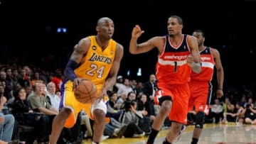 Mar 22, 2013; Los Angeles, CA, USA; Washington Wizards small forward Trevor Ariza (1) guards Los Angeles Lakers shooting guard Kobe Bryant (24) on a last second pass in the fourth quarter of the game at the Staples Center. Wizards won 103-100. Mandatory Credit: Jayne Kamin-Oncea-USA TODAY Sports