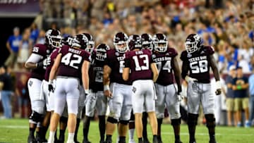 Sep 4, 2021; College Station, Texas, USA; Texas A&M Aggies quarterback Haynes King (13) in the huddle with offensive lineman Bryce Foster (61), offensive lineman Jahmir Johnson (58), offensive lineman Aki Ogunbiyi (74) and tight end Max Wright (42) during the fourth quarter against the Kent State Golden Flashes at Kyle Field. Mandatory Credit: Maria Lysaker-USA TODAY Sports