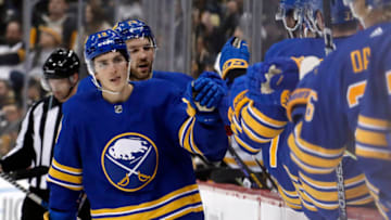 Dec 10, 2022; Pittsburgh, Pennsylvania, USA; Buffalo Sabres center Peyton Krebs (left) celebrates with the Buffalo bench after scoring a goal against the Pittsburgh Penguins during the third period at PPG Paints Arena. The Penguins won 3-1. Mandatory Credit: Charles LeClaire-USA TODAY Sports