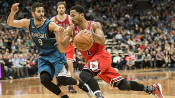 Feb 6, 2016; Minneapolis, MN, USA; Chicago Bulls guard Derrick Rose (1) dribbles the ball as Minnesota Timberwolves guard Ricky Rubio (9) defends at Target Center. The Timberwolves won 112-105. Mandatory Credit: Jeffrey Becker-USA TODAY Sports