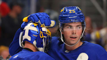 Oct 13, 2022; Buffalo, New York, USA; Buffalo Sabres goaltender Craig Anderson (41) and defenseman Owen Power (25) celebrate a win over the Ottawa Senators at KeyBank Center. Mandatory Credit: Timothy T. Ludwig-USA TODAY Sports