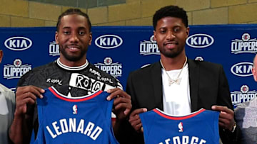 LOS ANGELES, CALIFORNIA - JULY 24: Kawhi Leonard and Paul George of the Los Angeles Clippers are introduced at Green Meadows Recreation Center on July 24, 2019 in Los Angeles, California. NOTE TO USER: User expressly acknowledges and agrees that, by downloading and or using this photograph, User is consenting to the terms and conditions of the Getty Images License Agreement. (Photo by Kevork Djansezian/Getty Images)