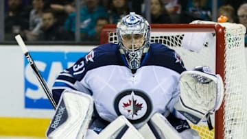 Apr 7, 2016; San Jose, CA, USA; Winnipeg Jets goalie Ondrej Pavelec (31) defends goal against a shot by the San Jose Sharks in the second period at SAP Center at San Jose. Winnipeg won 5-4. Mandatory Credit: John Hefti-USA TODAY Sports