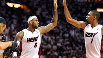Miami Heat's Chris Bosh congratulates teammate LeBron James, who nailed a big shot late in the third quarter against the Brooklyn Nets at the AmericanAirlines Arena in Miami for Game 1 of the Eastern Conference semifinals on Tuesday, May 6, 2014. (Robert Duyos/Sun Sentinel/MCT via Getty Images)