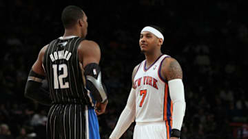 NEW YORK, NY - JANUARY 16: (NEW YORK DAILIES OUT) Carmelo Anthony #7 of the New York Knicks talks with Dwight Howard #12 of the Orlando Magic on January 16, 2012 at Madison Square Garden in New York City. The Magic defeated the Knicks 102-93. NOTE TO USER: User expressly acknowledges and agrees that, by downloading and/or using this Photograph, user is consenting to the terms and conditions of the Getty Images License Agreement. (Photo by Jim McIsaac/Getty Images)