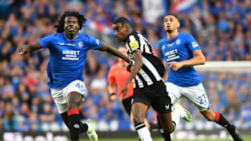 GLASGOW, SCOTLAND - JULY 18: Alexander Isak of Newcastle United wrestles with Johnly Yfeko of Rangers during the pre-season friendly match between Rangers and Newcastle at Ibrox Stadium on July 18, 2023 in Glasgow, Scotland. (Photo by Mark Runnacles/Getty Images)