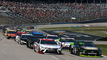 FORT WORTH, TEXAS - NOVEMBER 03: Kevin Harvick, driver of the #4 Busch Beer/Ducks Unlimited Ford, and Erik Jones, driver of the #20 Sport Clips Toyota, lead the field to turn one at the start of the Monster Energy NASCAR Cup Series AAA Texas 500 at Texas Motor Speedway on November 03, 2019 in Fort Worth, Texas. (Photo by Sean Gardner/Getty Images)