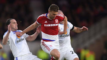 MIDDLESBROUGH, ENGLAND - APRIL 26: John O'Shea of Sunderland and Lee Cattermole of Sunderland (Obscured) tackle Ben Gibson of Middlesbrough during the Premier League match between Middlesbrough and Sunderland at the Riverside Stadium on April 26, 2017 in Middlesbrough, England. (Photo by Michael Regan/Getty Images)